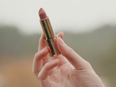 Close shot of a DOUGLAS lipstick in a hand